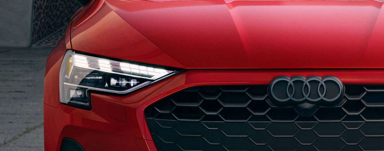 Passenger side headlight on a red 2025 Audi A3